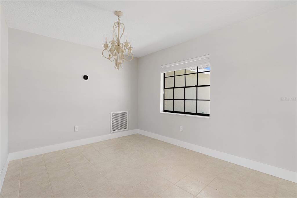 3929 North Sagomon Point Crystal River, FL 34428 - Photo 15 of 58 an empty room with windows and ceiling fan