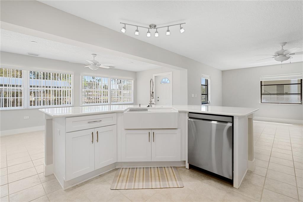 3929 North Sagomon Point Crystal River, FL 34428 - Photo 20 of 58 a kitchen with white cabinets and white appliances