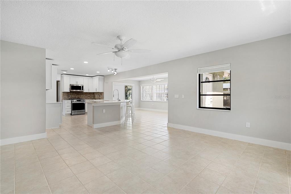 3929 North Sagomon Point Crystal River, FL 34428 - Photo 27 of 58 a view of kitchen with a sink wooden cabinet and windows