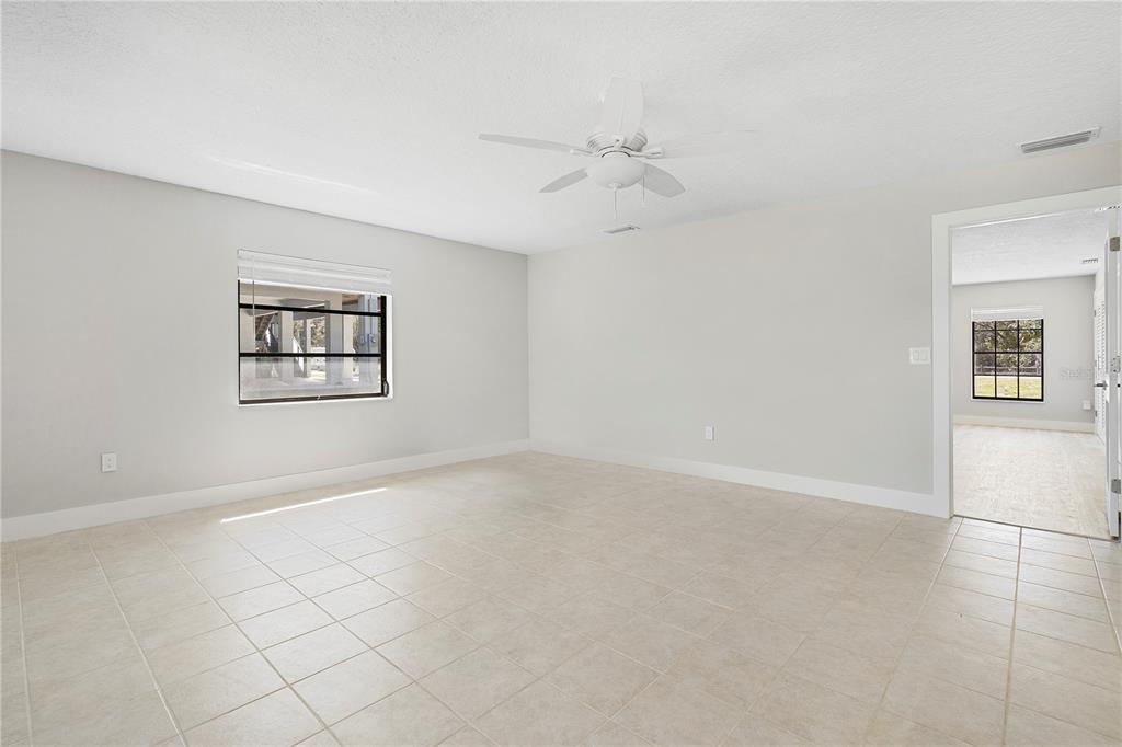 3929 North Sagomon Point Crystal River, FL 34428 - Photo 28 of 58 an empty room with windows and fan