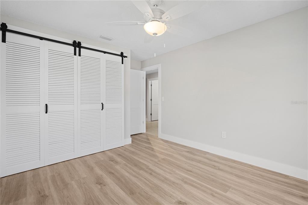 3929 North Sagomon Point Crystal River, FL 34428 - Photo 43 of 58 a view of an empty room with wooden floor