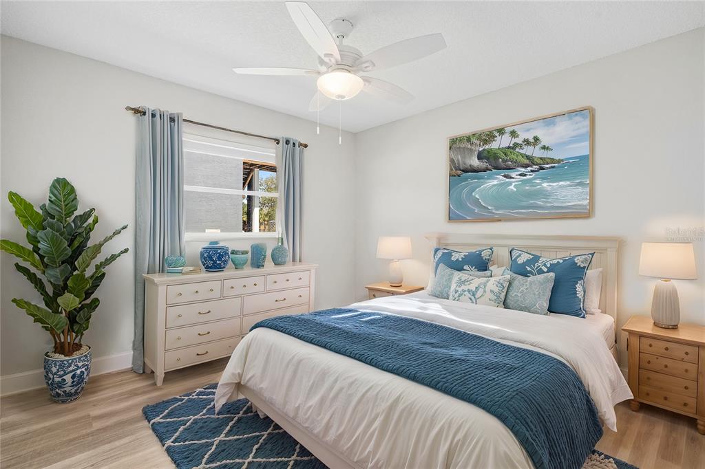 3929 North Sagomon Point Crystal River, FL 34428 - Photo 48 of 58 a bedroom with a large bed and a chandelier