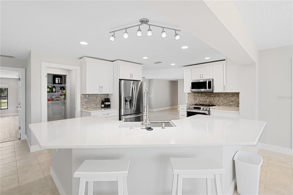 3929 North Sagomon Point Crystal River, FL 34428 - Photo 6 of 58 a kitchen with stainless steel appliances a refrigerator and microwave