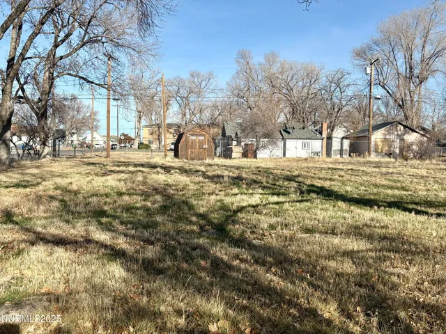 a view of a house with snow on the yard