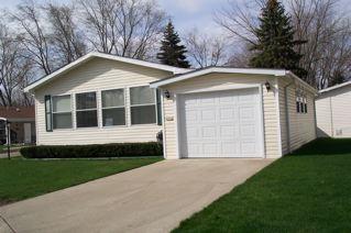 1172 Candida Road Elgin, IL 60123 - Photo 1 of 1 a front view of a house with a garden