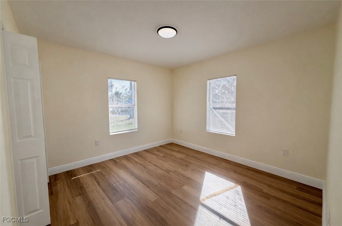 261 Miramar Road Fort Myers, FL 33905 - Photo 12 of 24 a view of room with window and ceiling fan