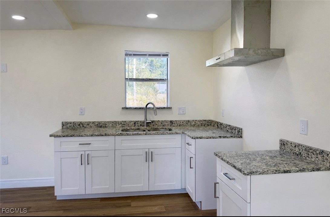 261 Miramar Road Fort Myers, FL 33905 - Photo 15 of 24 a kitchen with granite countertop a sink and cabinets