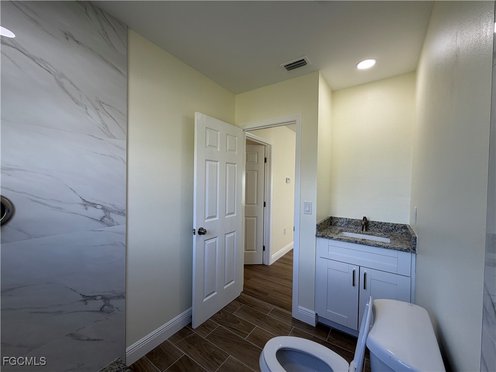 261 Miramar Road Fort Myers, FL 33905 - Photo 17 of 24 a bathroom with a sink and a mirror