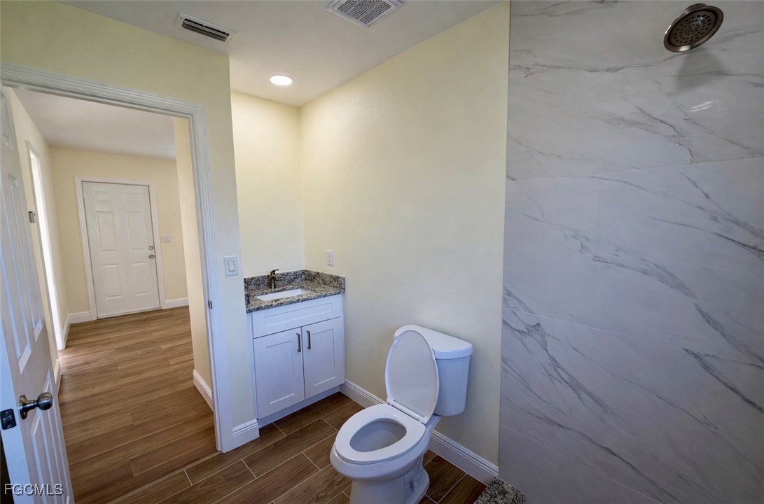 261 Miramar Road Fort Myers, FL 33905 - Photo 18 of 24 a bathroom with a toilet and a sink