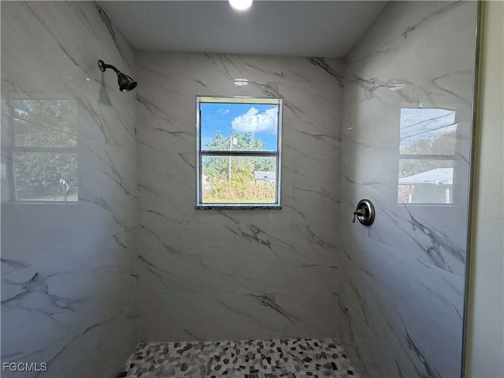 261 Miramar Road Fort Myers, FL 33905 - Photo 19 of 24 a bathroom with a window