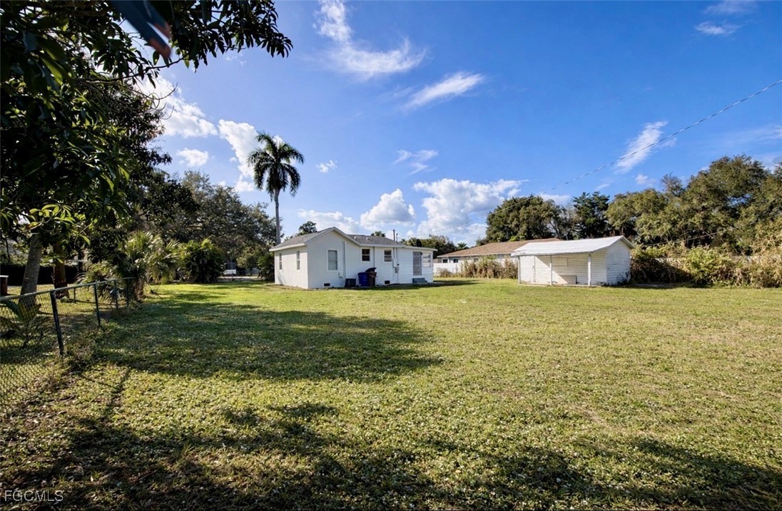 261 Miramar Road Fort Myers, FL 33905 - Photo 20 of 24 a view of a house with a yard