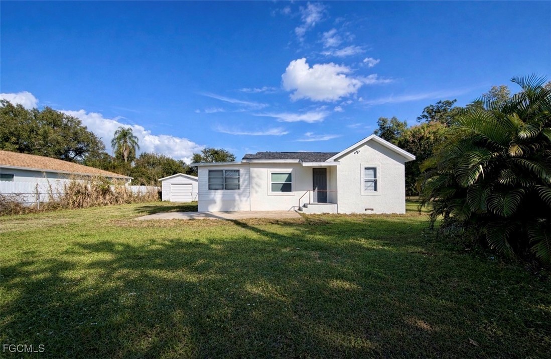 261 Miramar Road Fort Myers, FL 33905 - Photo 2 of 24 a front view of a house with a garden
