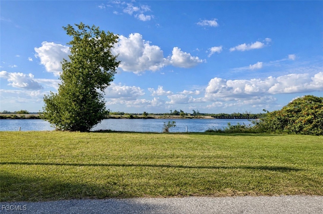 261 Miramar Road Fort Myers, FL 33905 - Photo 23 of 24 a view of a lake with a big yard