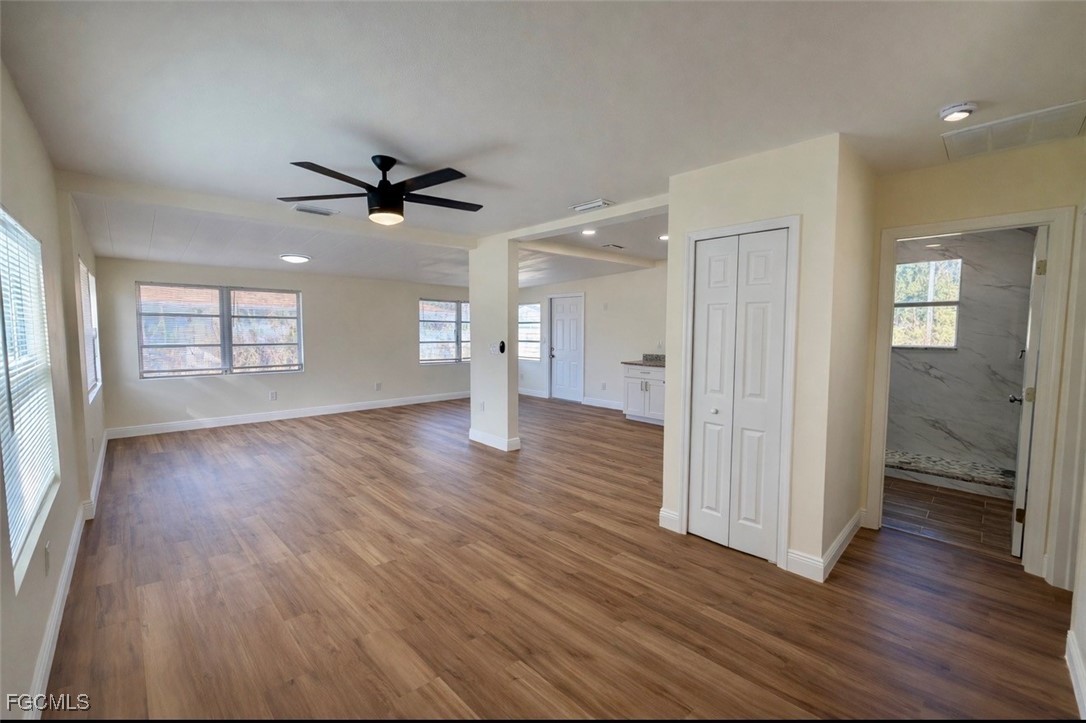 261 Miramar Road Fort Myers, FL 33905 - Photo 9 of 24 an empty room with wooden floor and windows