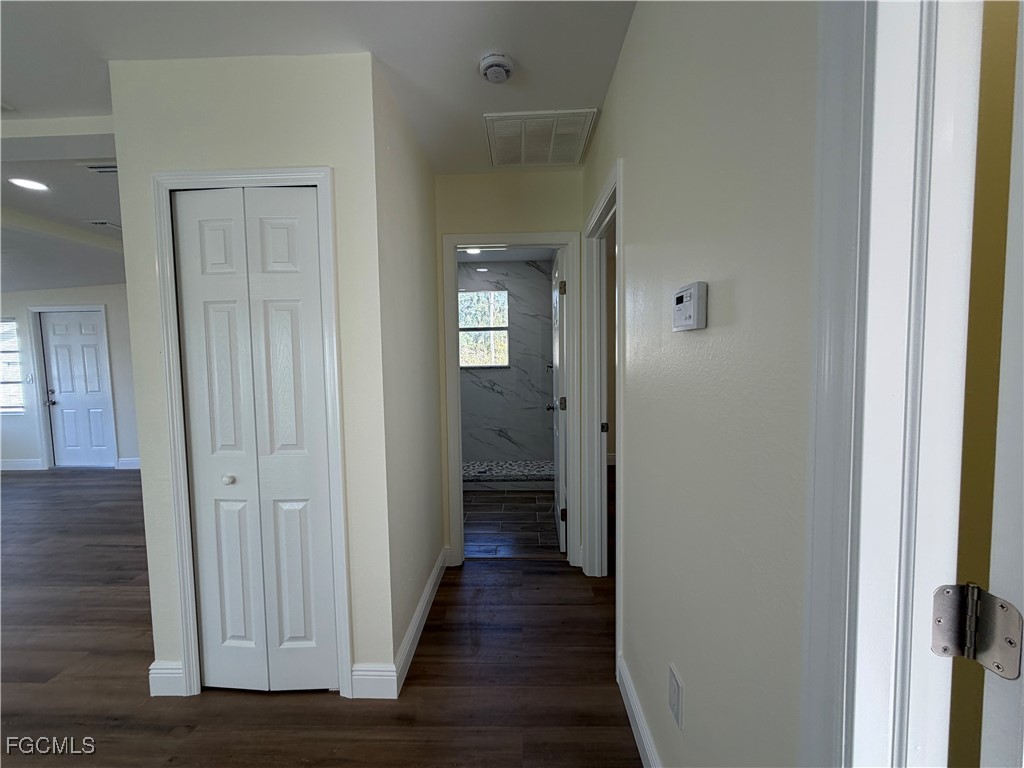 261 Miramar Road Fort Myers, FL 33905 - Photo 10 of 24 a view of a hallway with wooden floor