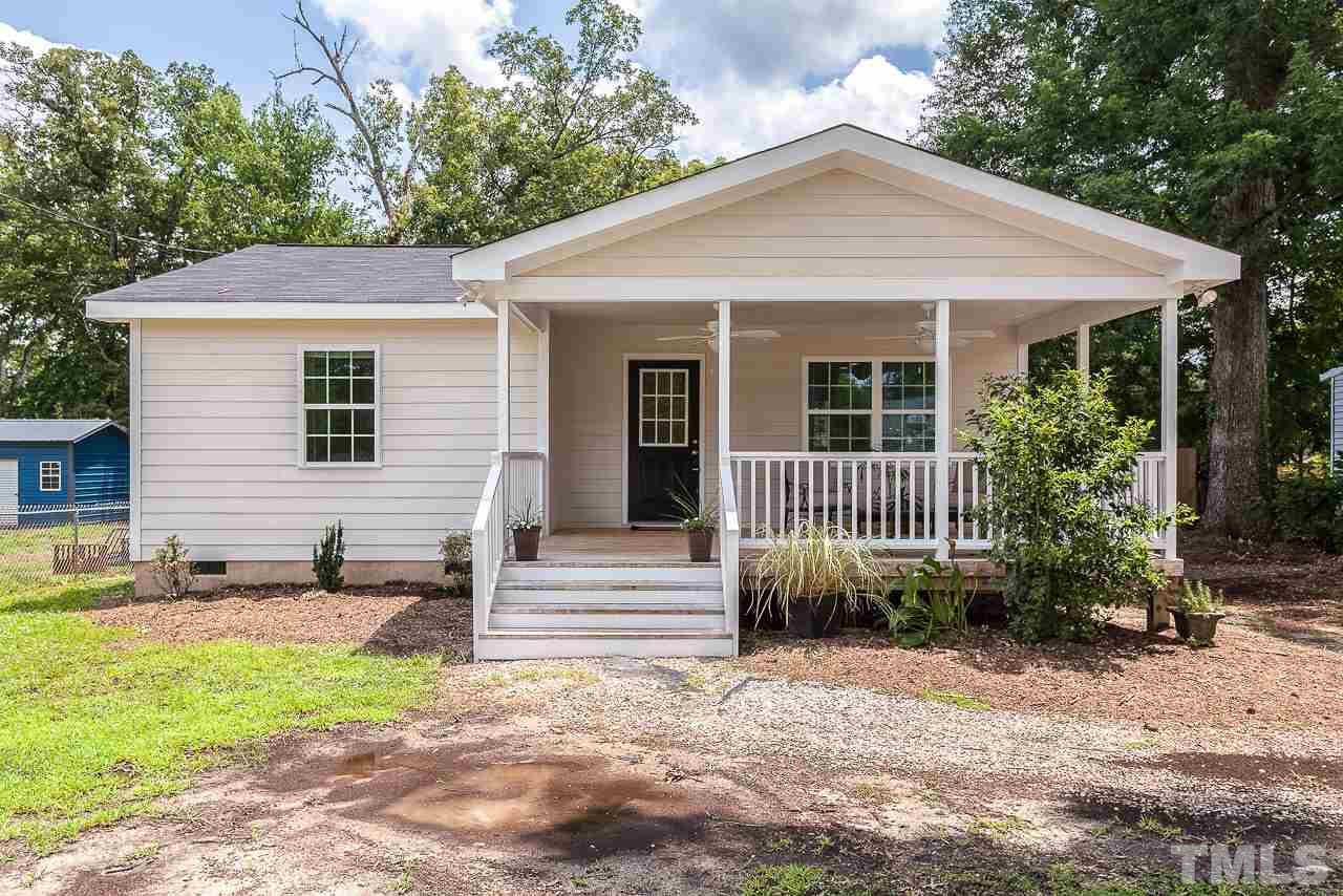 620 Brighton Road Raleigh, NC 27610 - Photo 1 of 25 a view of a house with a yard and plants