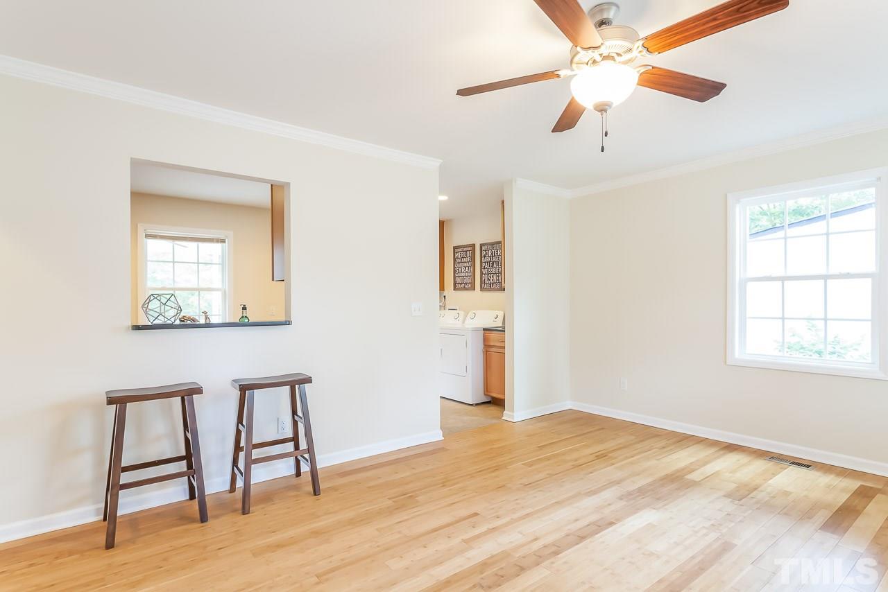 620 Brighton Road Raleigh, NC 27610 - Photo 13 of 25 a view of an empty room with a window and wooden floor