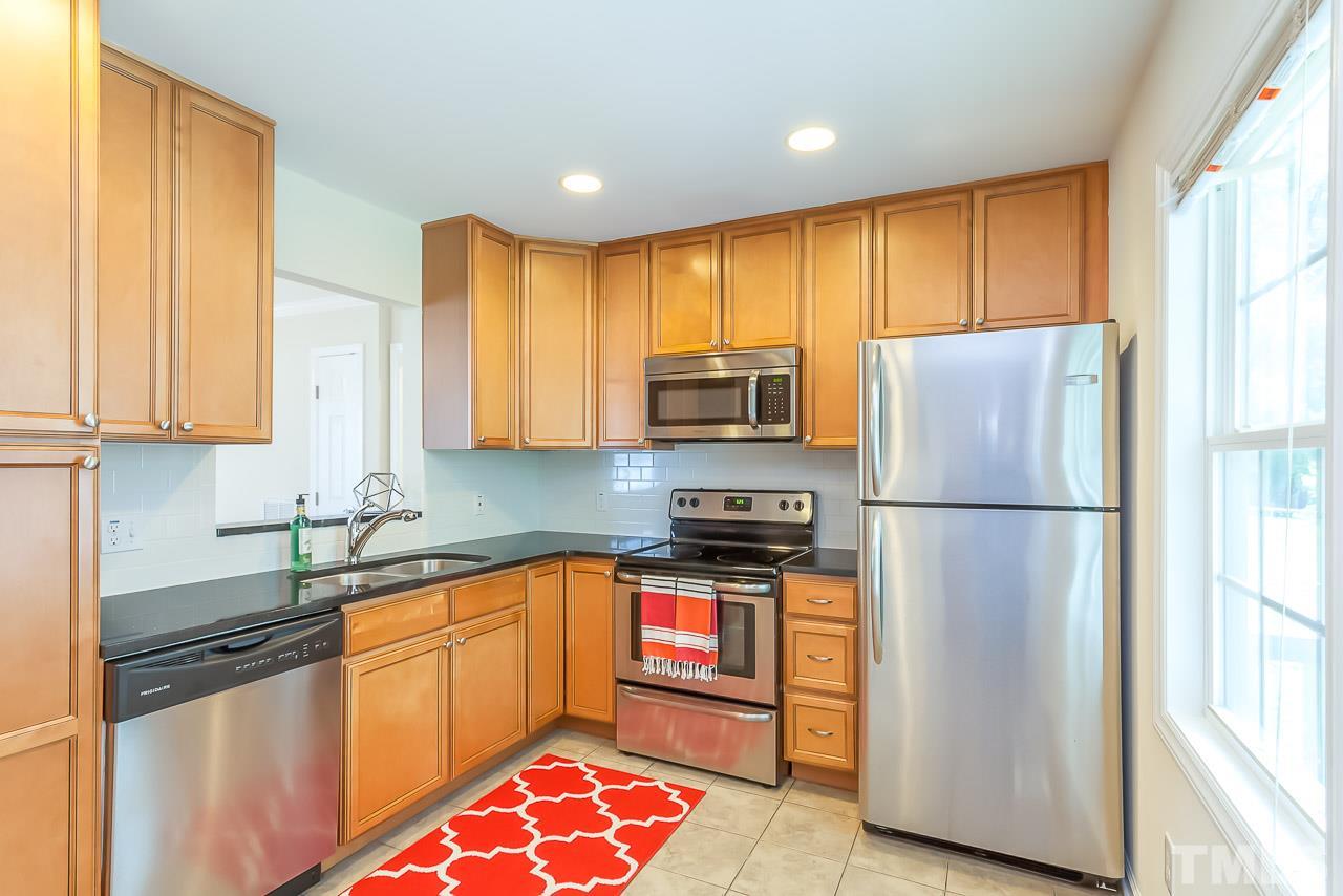 620 Brighton Road Raleigh, NC 27610 - Photo 16 of 25 a kitchen with stainless steel appliances granite countertop a refrigerator sink and microwave