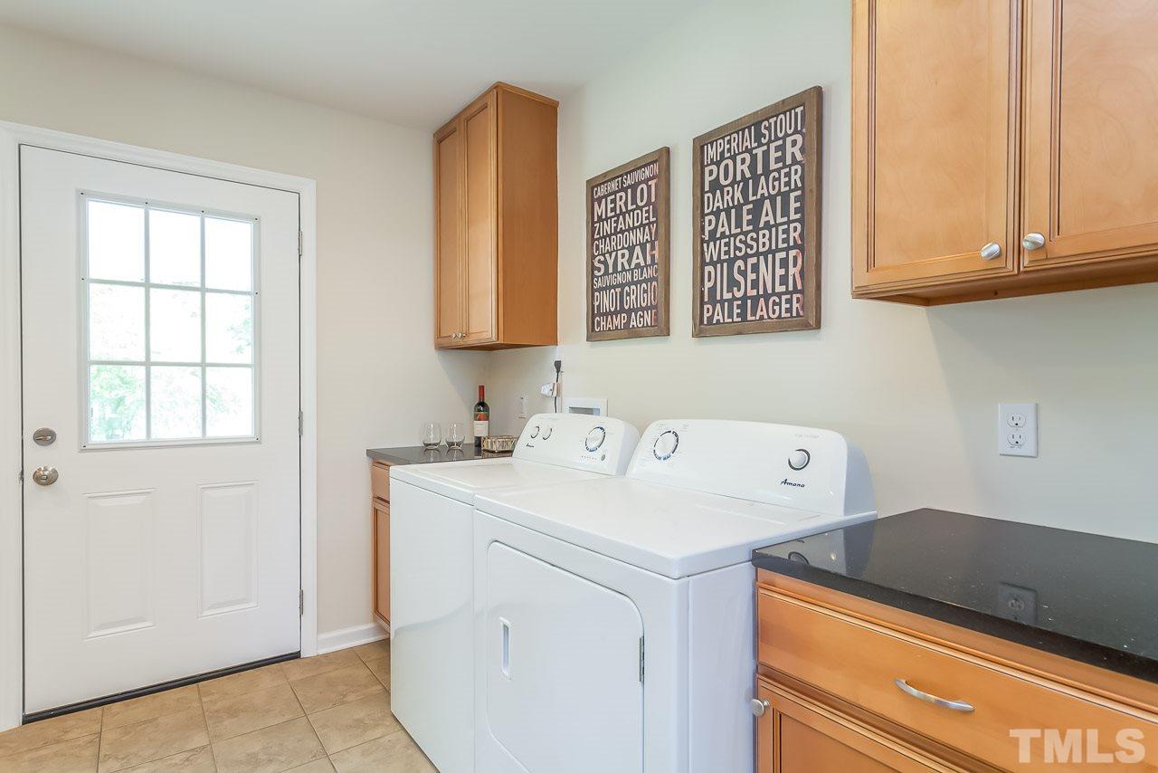 620 Brighton Road Raleigh, NC 27610 - Photo 25 of 25 a utility room with dryer and washer