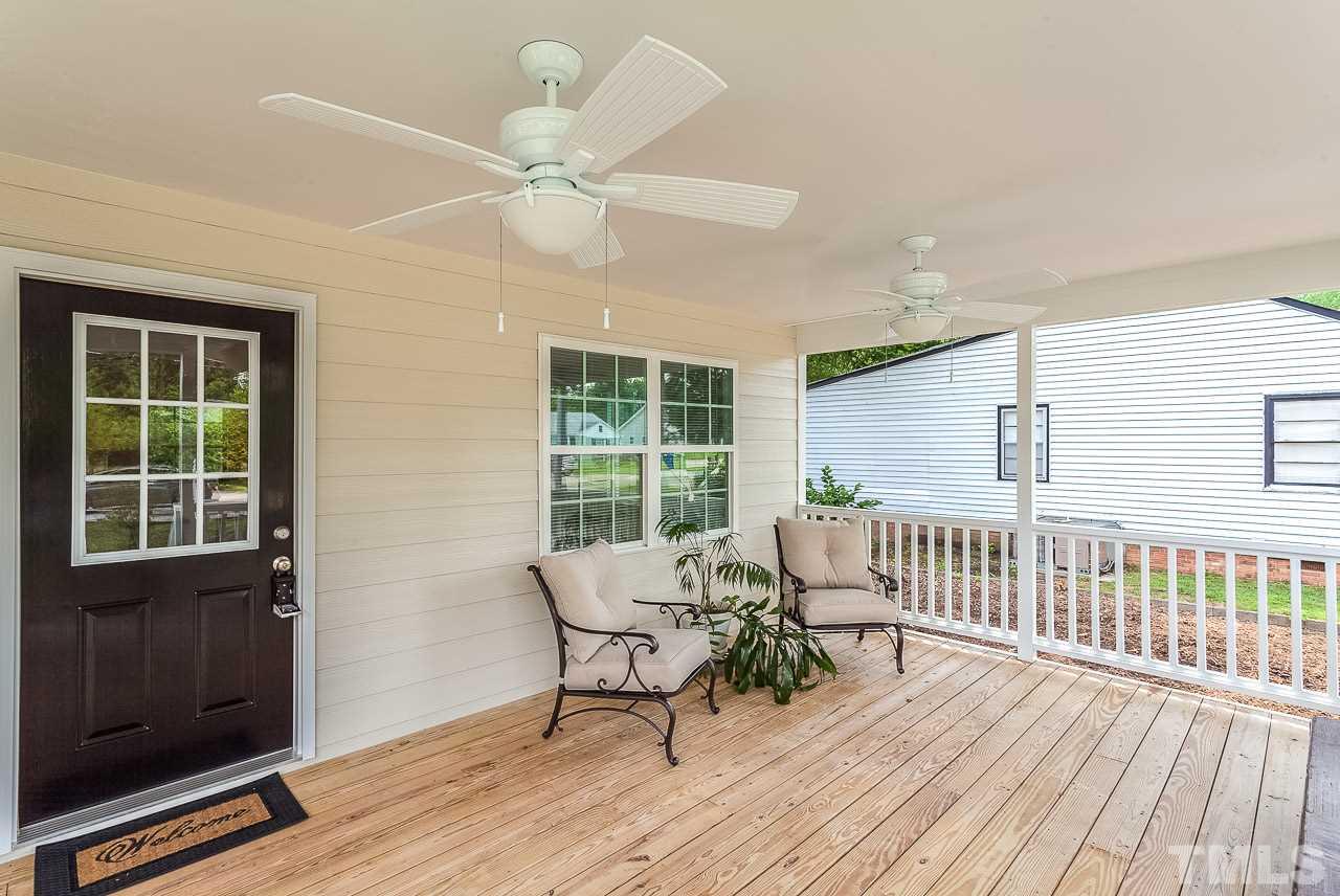 620 Brighton Road Raleigh, NC 27610 - Photo 4 of 25 a view of a house with wooden deck and furniture