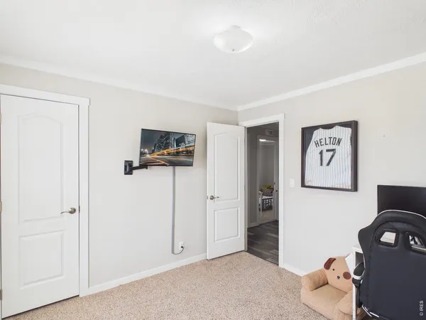 a view of a livingroom with furniture and an empty room