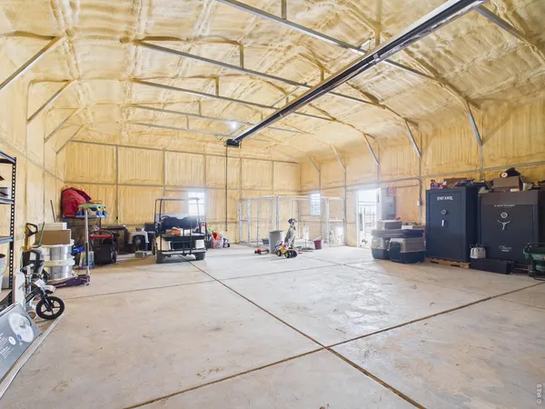 a view of a garage with cars