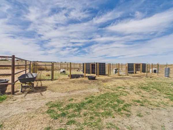 a big yard with table and chairs