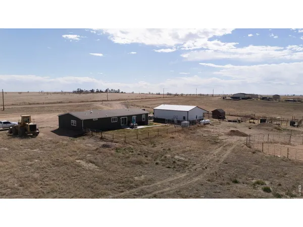 a view of a lake with houses in the back