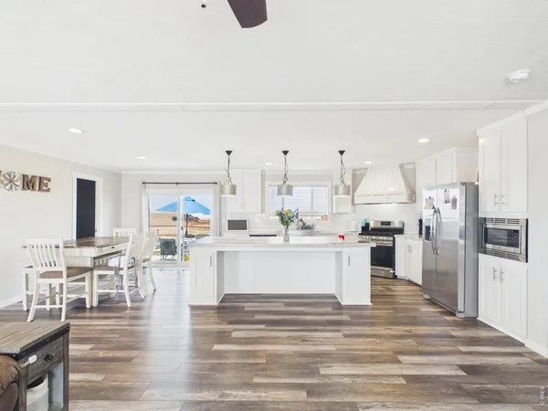 a kitchen with stainless steel appliances refrigerator and cabinets