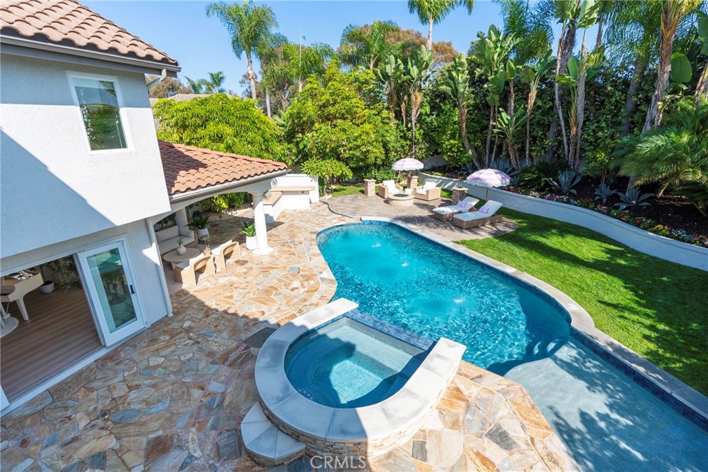 20 Regina Dana Point, CA 92629 - Photo 13 of 60 Private backyard oasis featuring a pool, spa, and scenic views, ideal for outdoor entertaining.