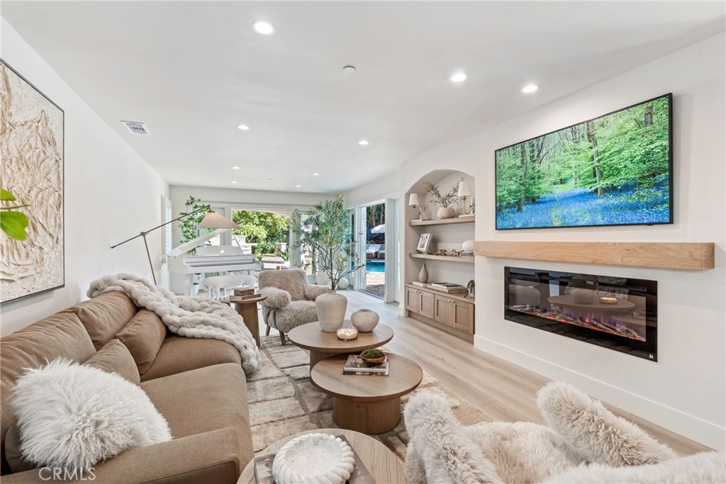 20 Regina Dana Point, CA 92629 - Photo 16 of 60 Modern and spacious living room with stylish furniture and a seamless flow into the open space.