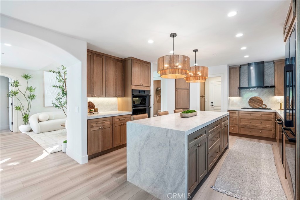 20 Regina Dana Point, CA 92629 - Photo 20 of 60 a kitchen with kitchen island granite countertop a stove and a sink