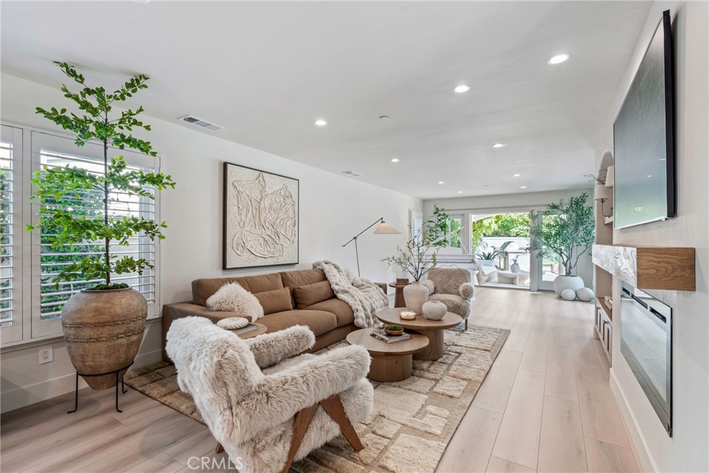 20 Regina Dana Point, CA 92629 - Photo 24 of 60 Bright and inviting living room with comfortable seating, perfect for family movie nights and social gatherings.
