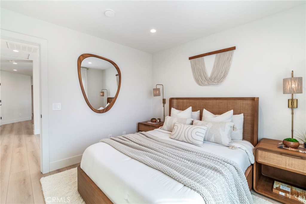 20 Regina Dana Point, CA 92629 - Photo 35 of 60 Bright bedroom with large windows, modern decor, and a calming atmosphere for rest.