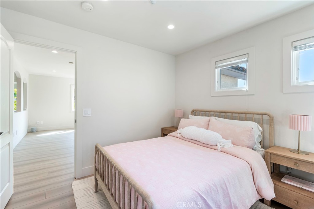 20 Regina Dana Point, CA 92629 - Photo 37 of 60 a bedroom with a bed and wooden floor