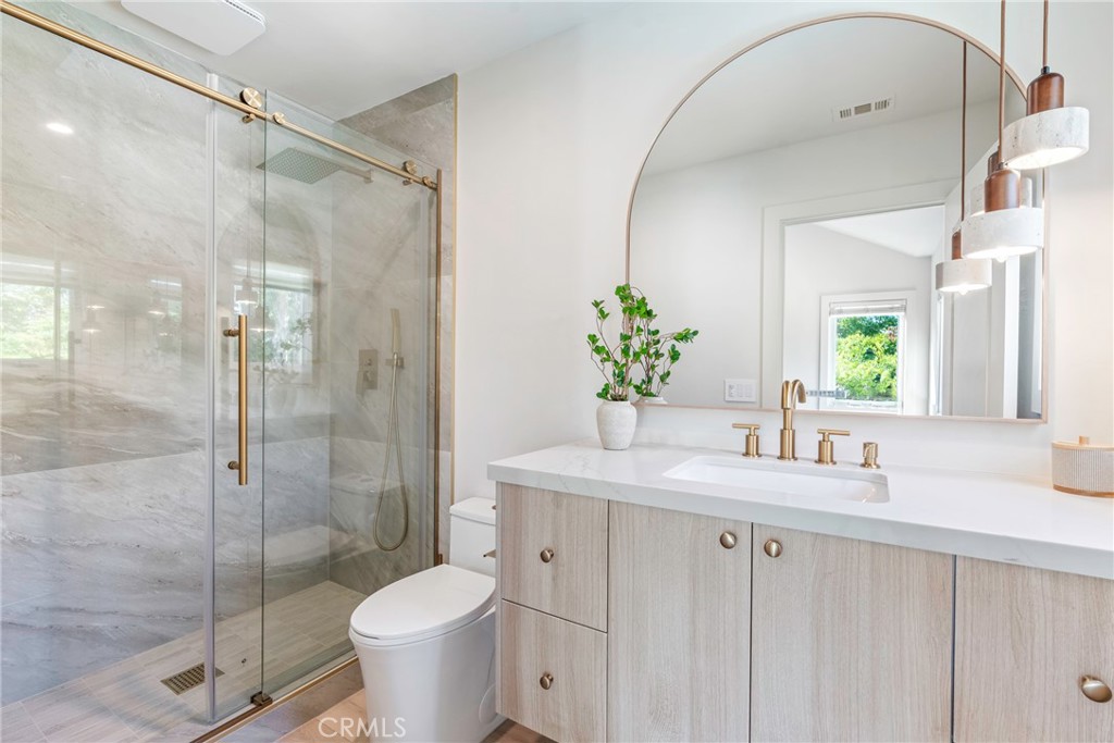 20 Regina Dana Point, CA 92629 - Photo 42 of 60 a bathroom with a granite countertop sink toilet and shower