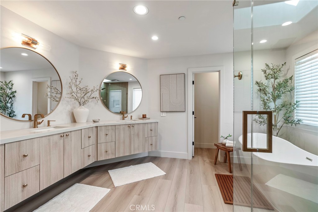 20 Regina Dana Point, CA 92629 - Photo 43 of 60 a spacious bathroom with a double vanity sink and a mirror