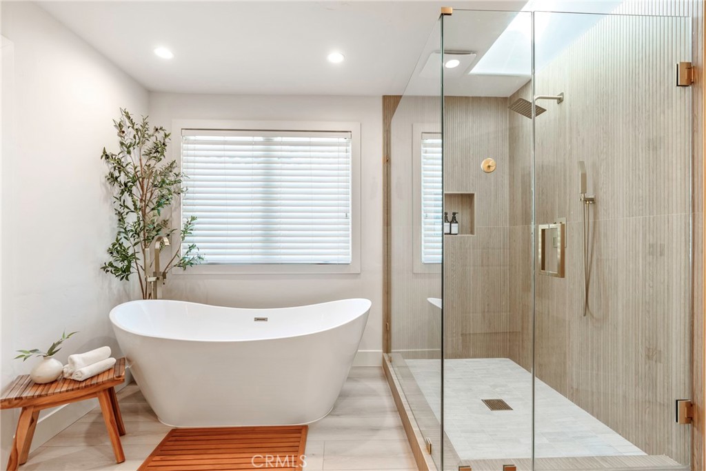 20 Regina Dana Point, CA 92629 - Photo 44 of 60 a bathroom with a bathtub and shower