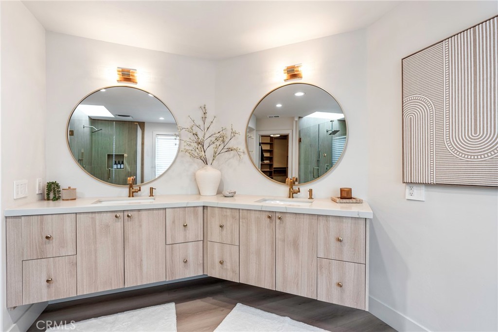 20 Regina Dana Point, CA 92629 - Photo 45 of 60 a bathroom with a double vanity sink and a mirror