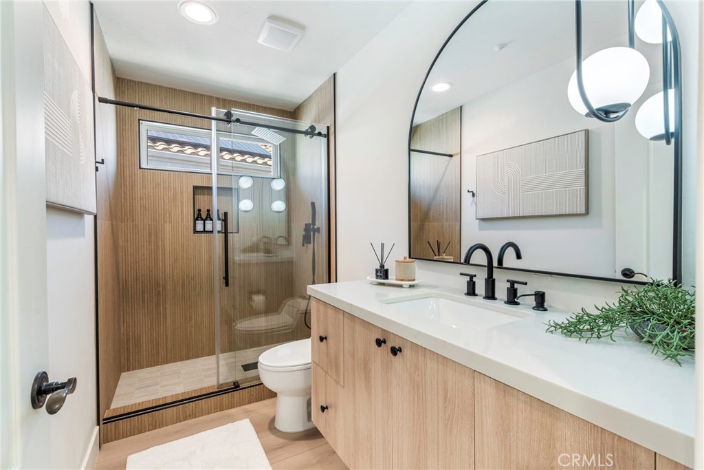 20 Regina Dana Point, CA 92629 - Photo 7 of 60 a bathroom with a double vanity sink mirror and shower