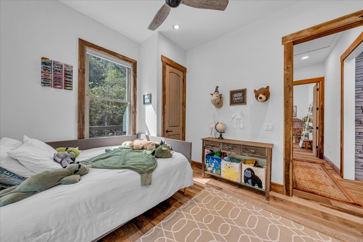 317 Little Creek Road Pleasant Shade, TN 37145 - Photo 34 of 64 a bed room with a bed and a couch