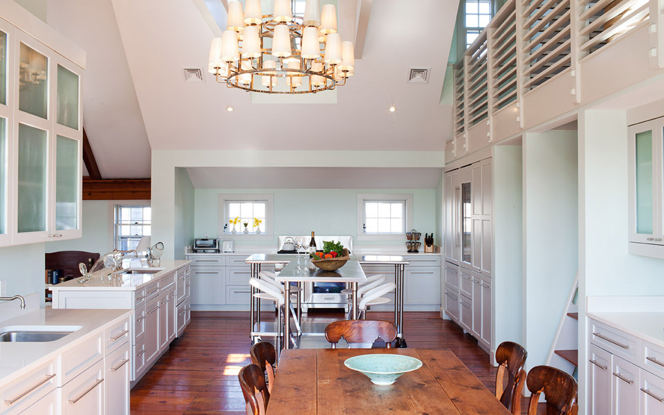 36 R Cliff Road Nantucket, MA 02554 - Photo 11 of 22 a dining room with wooden floor a chandelier a wooden table and chairs