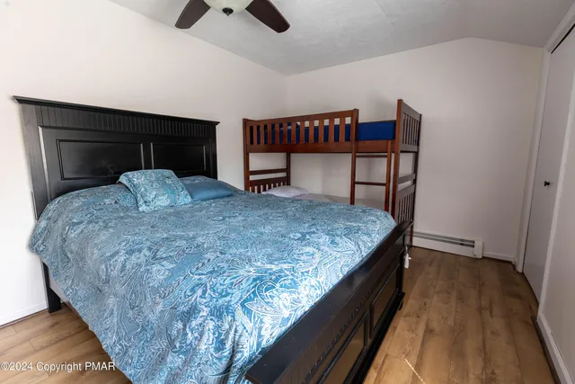 a bedroom with a bed and cabinets