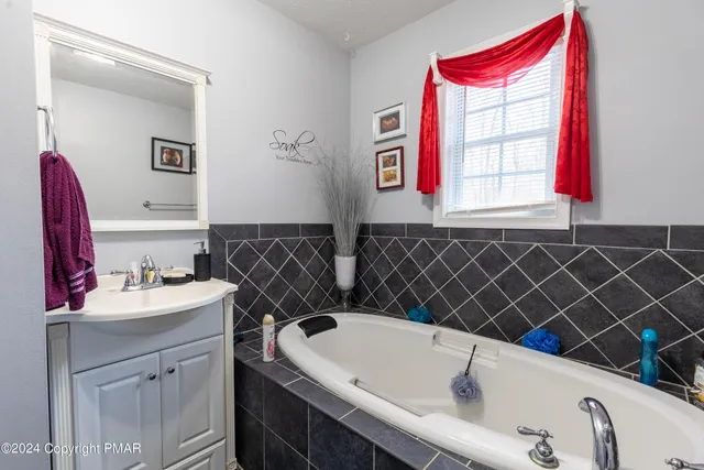 a bathroom with a sink and a bathtub