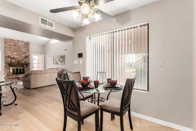 a dining room with furniture and window