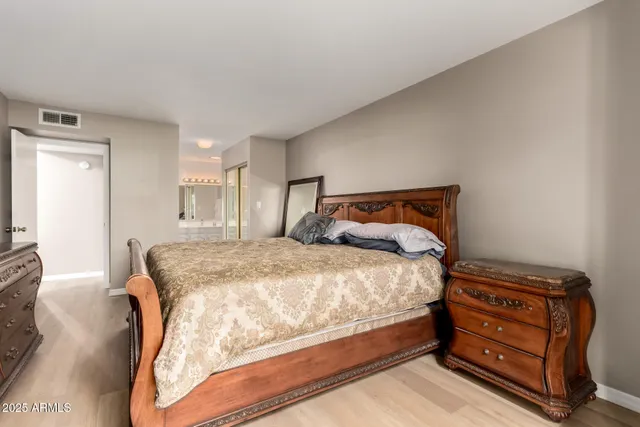 a bedroom with a bed and a tv