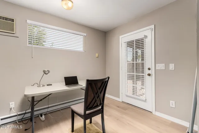 a workspace with furniture and window