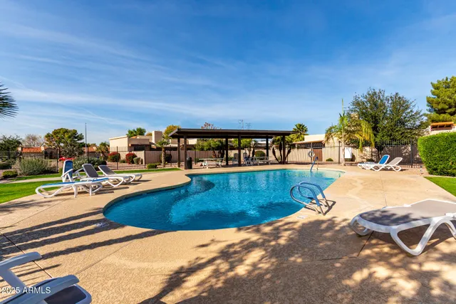 a view of swimming pool with outdoor seating