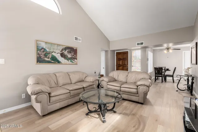 a living room with furniture and a large window