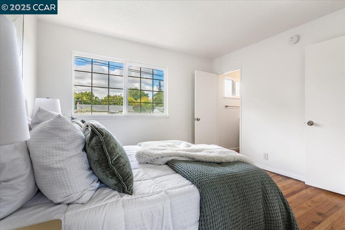 4081 Salem Street Concord, CA 94521 - Photo 16 of 27 a bed sitting in a bedroom next to a window